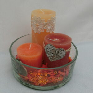 Tris di candele arancioni